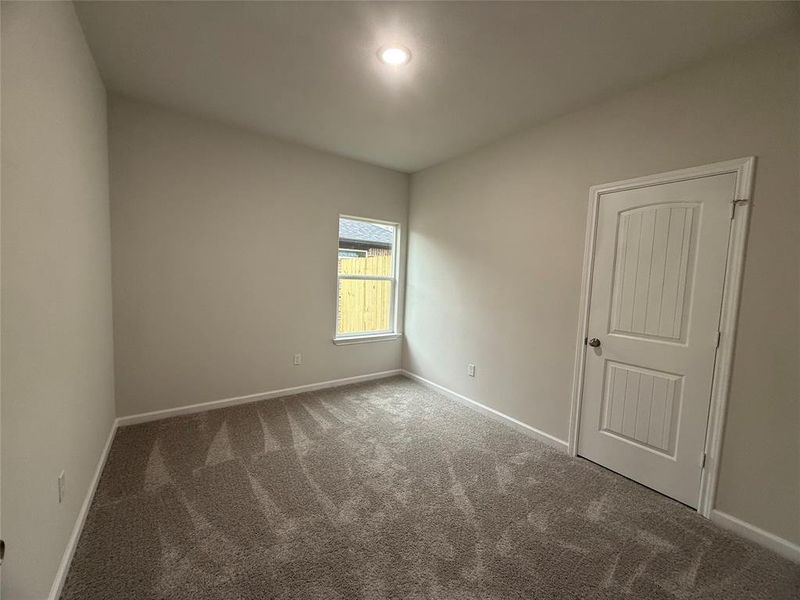 Empty room with carpet floors