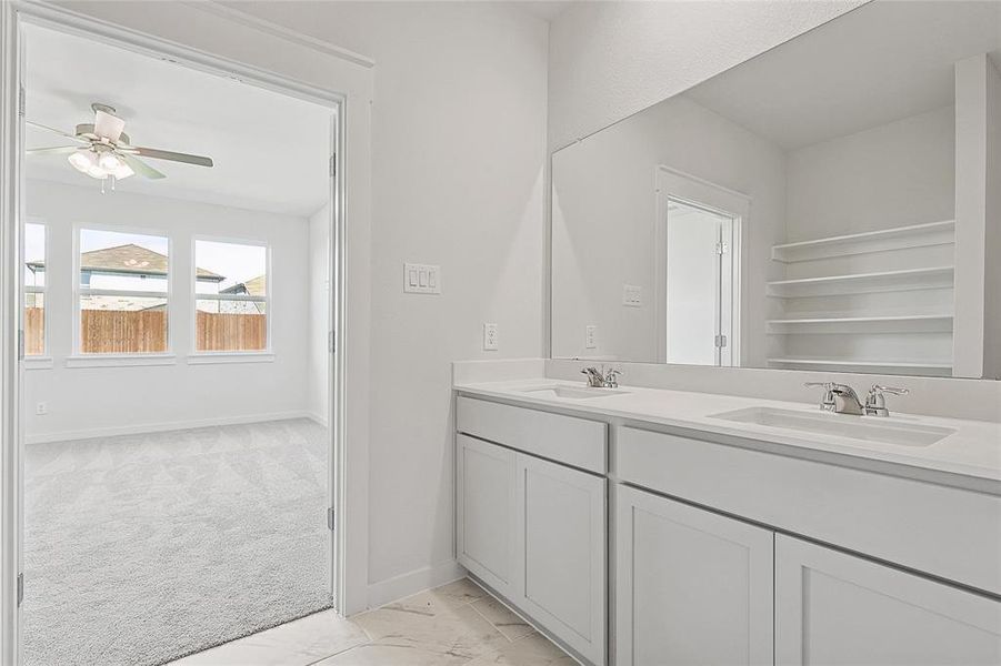 Bathroom with vanity and ceiling fan