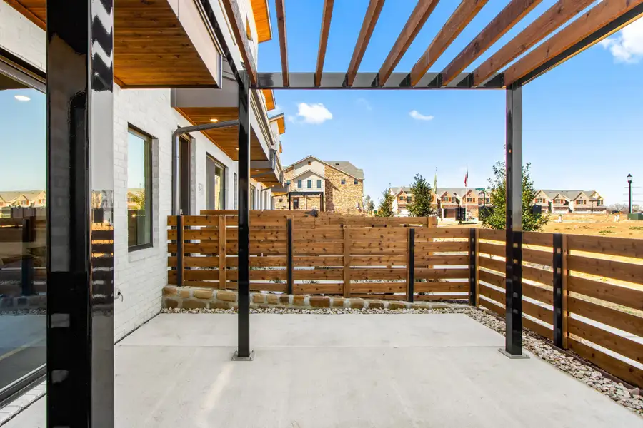 Exterior details and patio area of a home in Wildridge, Oak Point (Image 4).