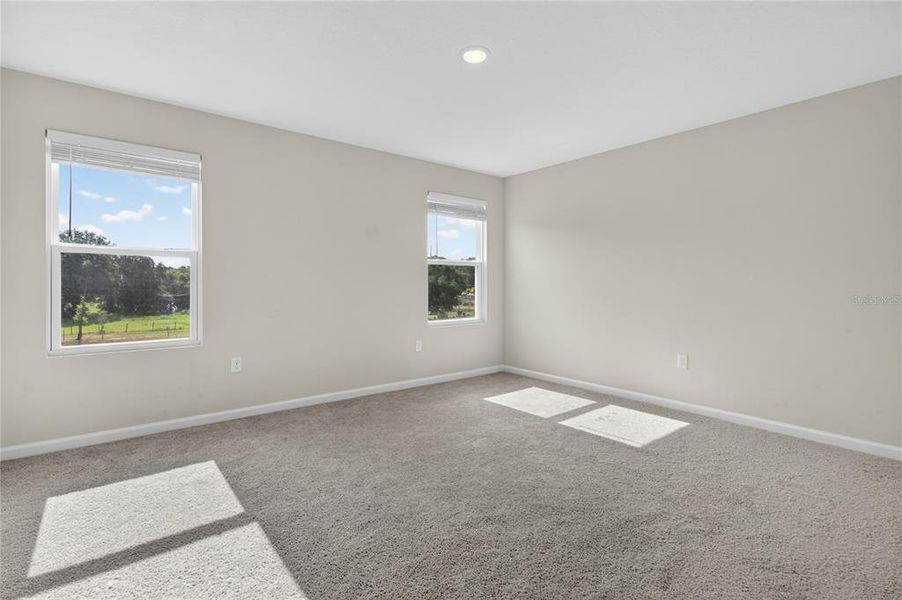 Spacious, unfurnished interior of a new home in Seasons at Forest Creek, Haines City (Image 53).