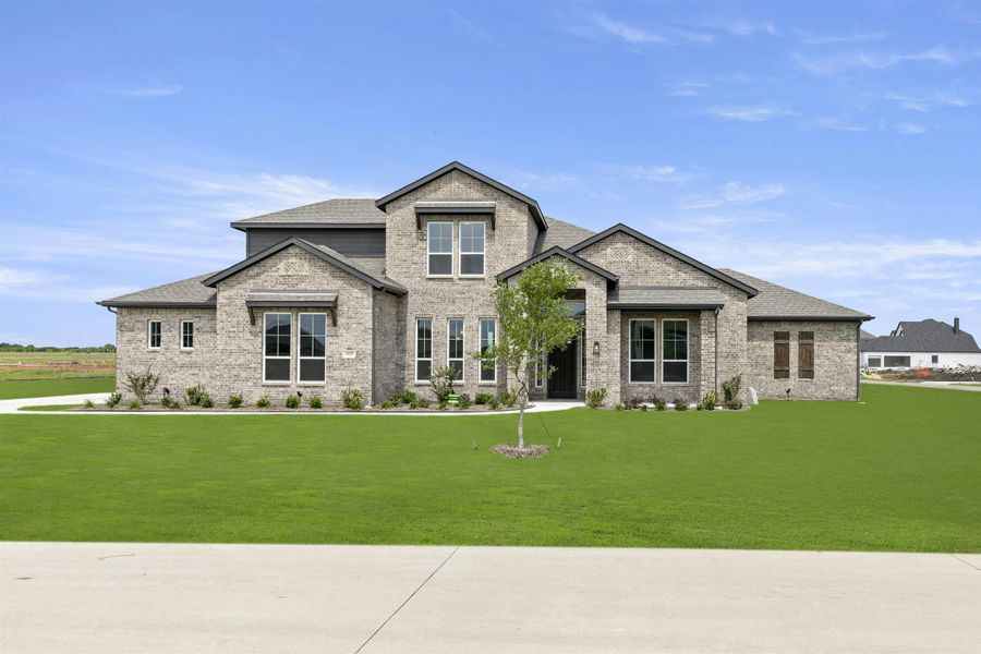 Representative exterior photo of a completed home built from the Reid by Kindred Homes in Heritage, McLendon-Chisholm, TX (Image 23). Representative exterior photo of a completed home built from the Reid by Kindred Homes in Heritage, McLendon-Chisholm, TX (Image 23).