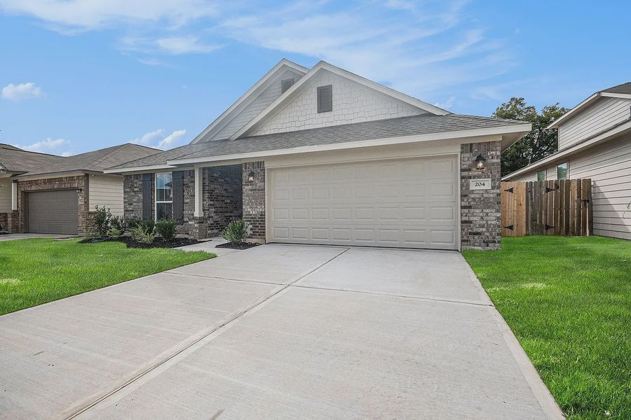 Front exterior of a new home in Kiber Reserve, Angleton, TX, highlighting curb appeal (Image 2). Front exterior of a new home in Kiber Reserve, Angleton, TX, highlighting curb appeal (Image 2).