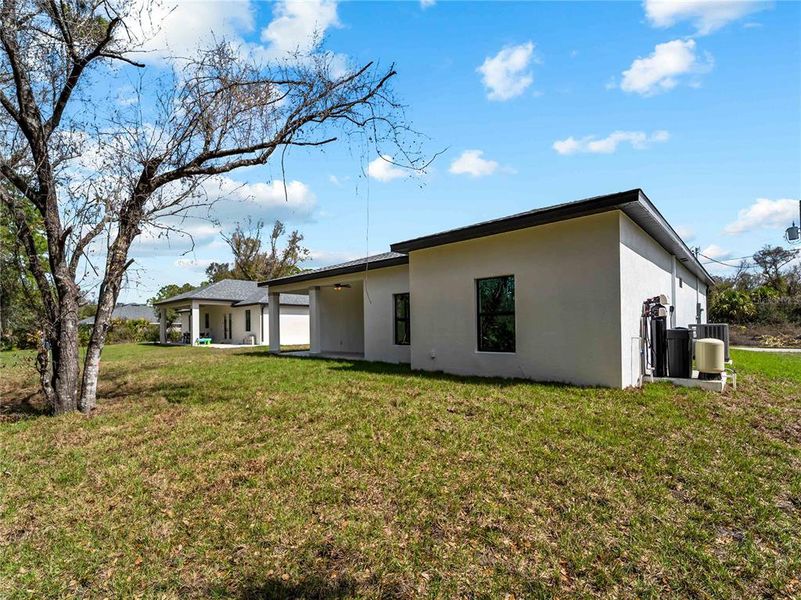 Exterior details and patio area of a home in , North Port (Image 36).