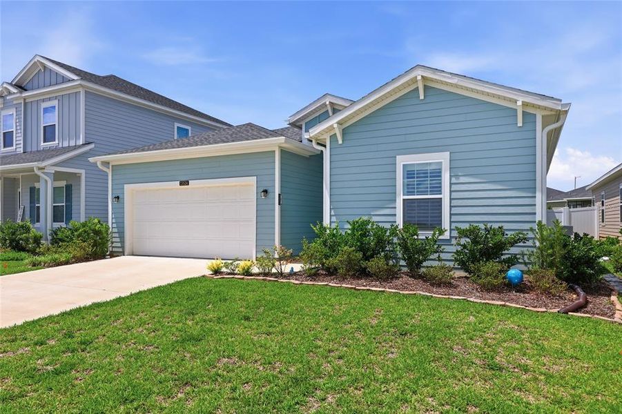 Front exterior of a new home in Trailhead Landing, Alachua, FL, highlighting curb appeal (Image 22).
