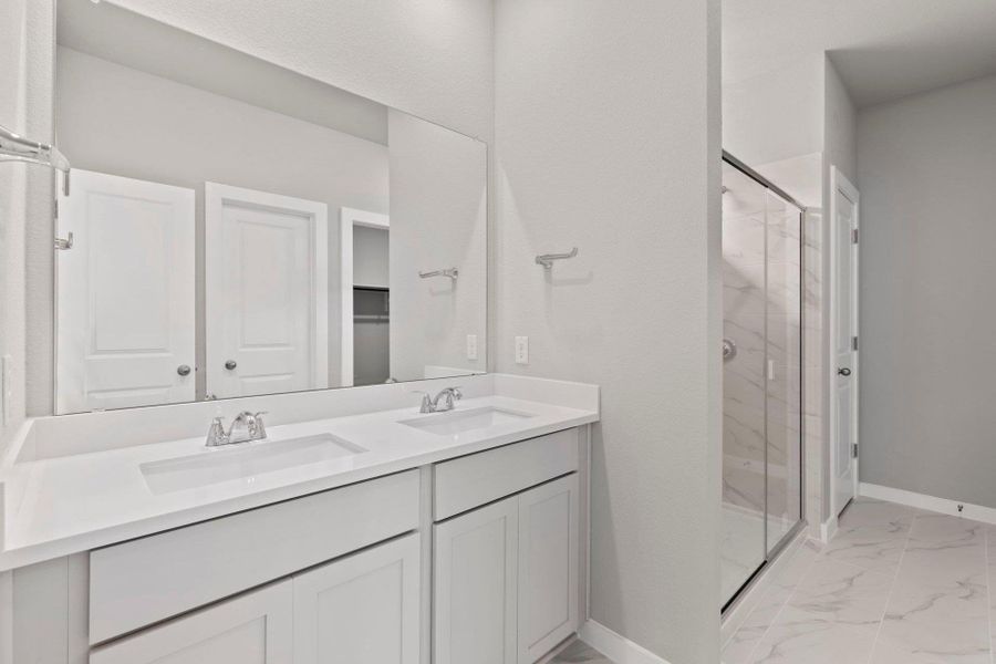 Primary Bath retreat with dual vanities & walk-in shower