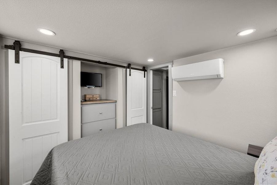 Plus a built in dresser and two closets behind the space saving barn style doors.