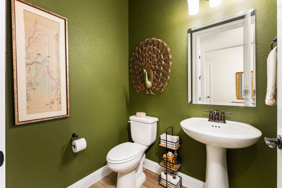 The home also features a convenient half bathroom. The home also features a convenient half bathroom.