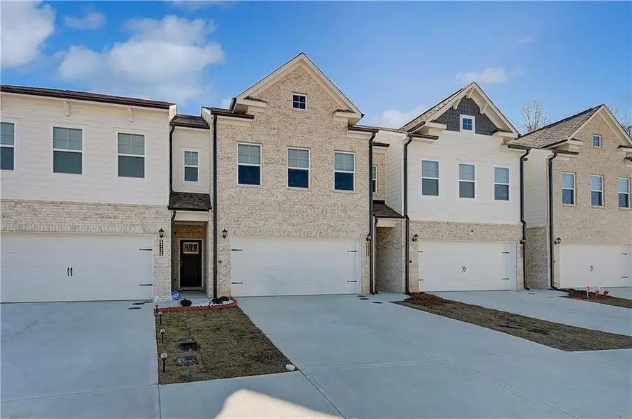 Front exterior of a new home in Auburn Ridge, Riverdale, GA, highlighting curb appeal (Image 15). Front exterior of a new home in Auburn Ridge, Riverdale, GA, highlighting curb appeal (Image 15).