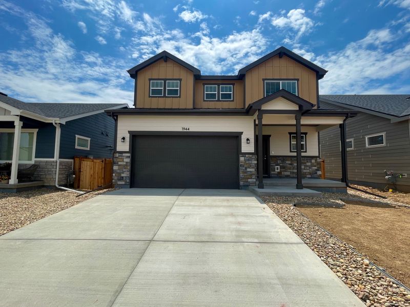 Front exterior of a new home in Granary, Johnstown, CO, highlighting curb appeal (Image 2). Front exterior of a new home in Granary, Johnstown, CO, highlighting curb appeal (Image 2).