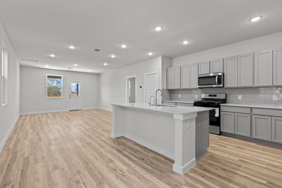 A kitchen with white cabinets. A kitchen with white cabinets.