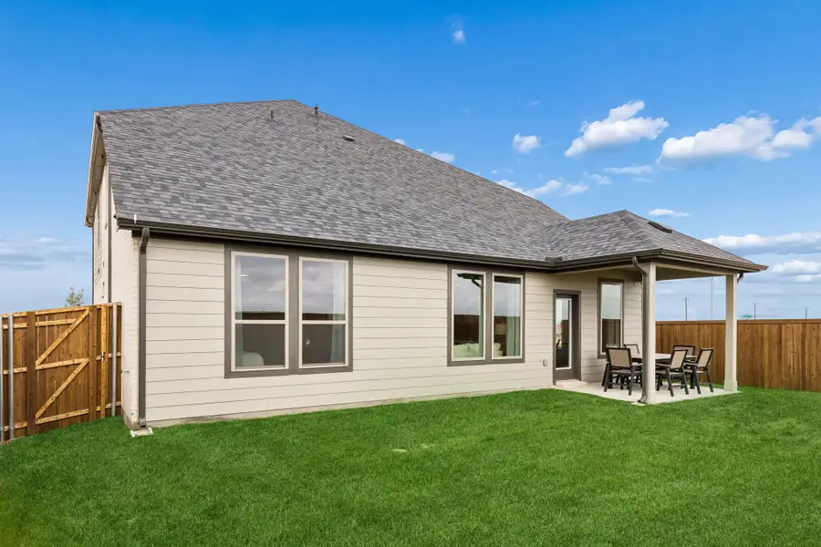 Covered Patio in a Madero Winters Model Home in Haslet TX by Trophy Signature Homes