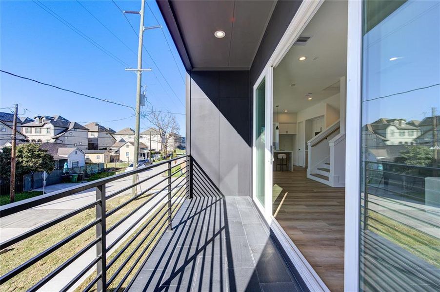 Large balcony with a double slider door, perfect for grilling. During the lovely mild Houston winters, leave the doors open to enjoy the cool outside breeze in your living room / dining room.