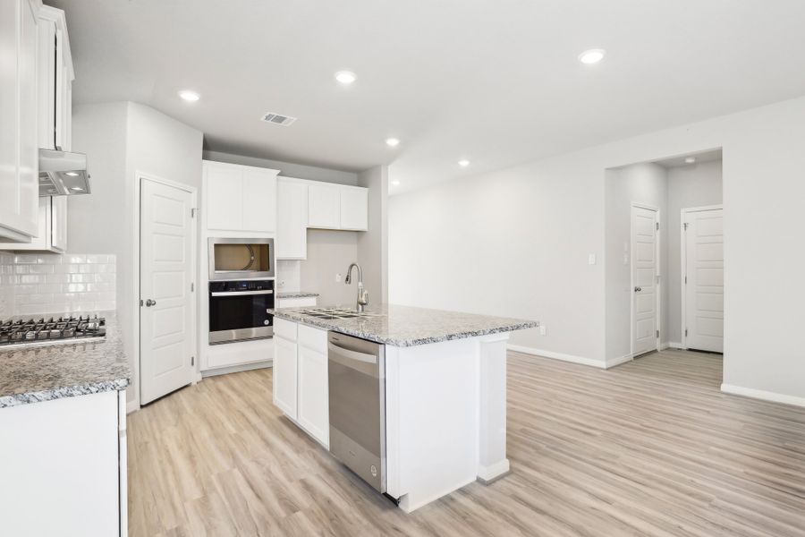 Kitchen in the Oleander floorplan at a Meritage Homes community. Kitchen in the Oleander floorplan at a Meritage Homes community.