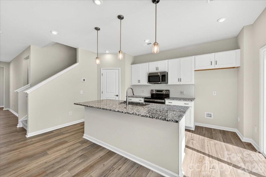 Chef-inspired kitchen with white cabinets Chef-inspired kitchen with white cabinets