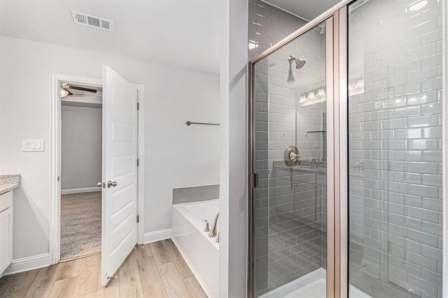 Primary Bathroom with Separate Shower and Bathtub