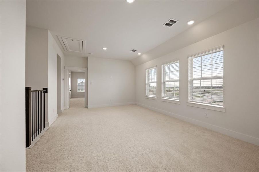Upstairs you'll find a spacious game room that is the perfect place for additional family fun time.