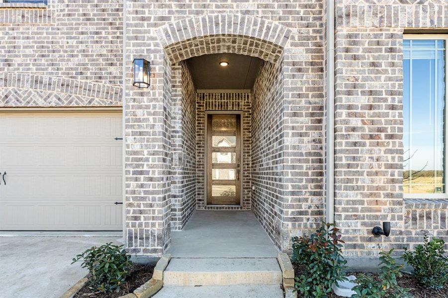 Exterior details and patio area of a home in Creekview Meadows, Pilot Point (Image 27).