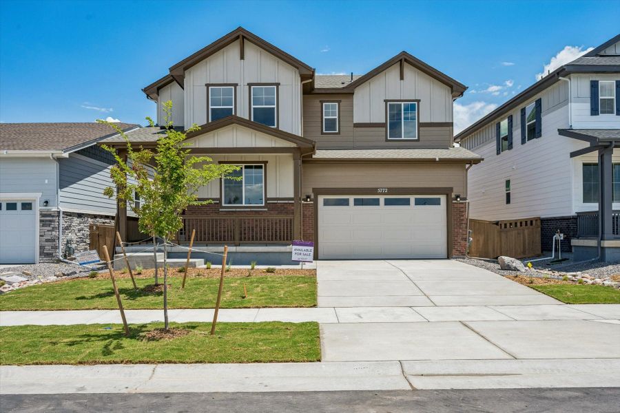 Front exterior of a new home in Painted Prairie, Aurora, CO, highlighting curb appeal (Image 1). Front exterior of a new home in Painted Prairie, Aurora, CO, highlighting curb appeal (Image 1).