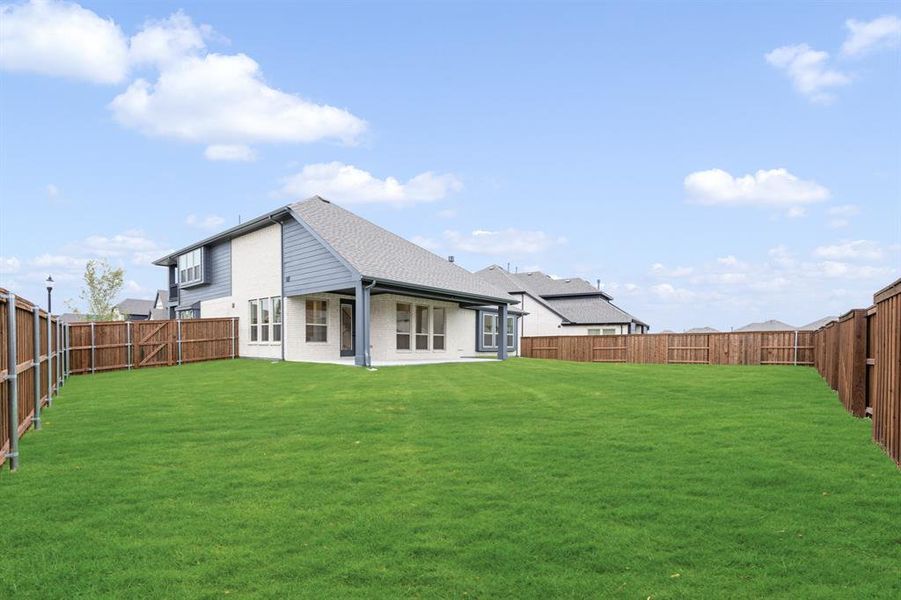 Exterior details and patio area of a home in Windsong Ranch Classic 61, Prosper (Image 19). Exterior details and patio area of a home in Windsong Ranch Classic 61, Prosper (Image 19).