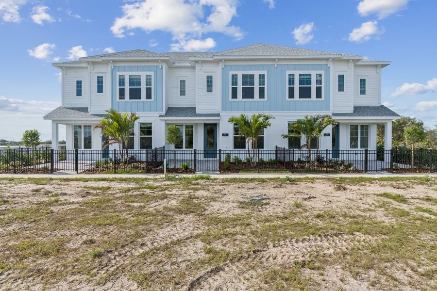 Exterior details and patio area of a home in Emerald Landing at Waterside at Lakewood Ranch – Towns, Sarasota (Image 29).
