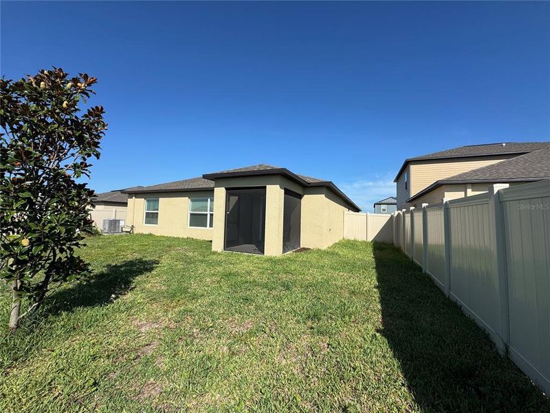 Exterior details and patio area of a home in Prosperity Lakes, Parrish (Image 4).