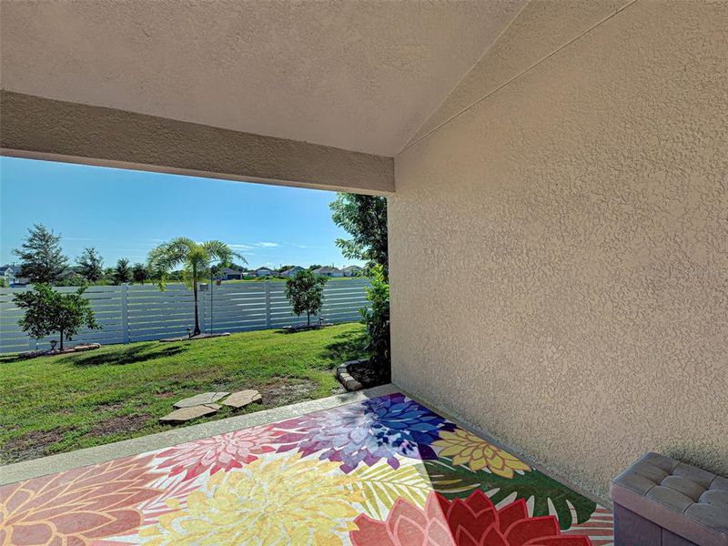 Exterior details and patio area of a home in Watercress Cove, North Port (Image 3).