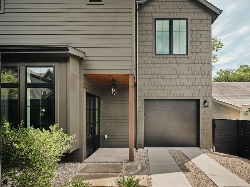 View of front facade featuring a garage and concrete driveway View of front facade featuring a garage and concrete driveway