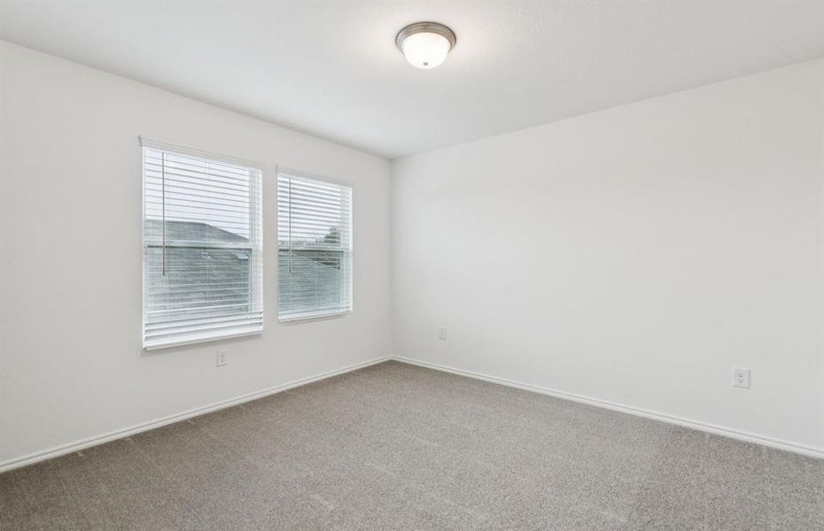 Spacious secondary bedroom with large windows