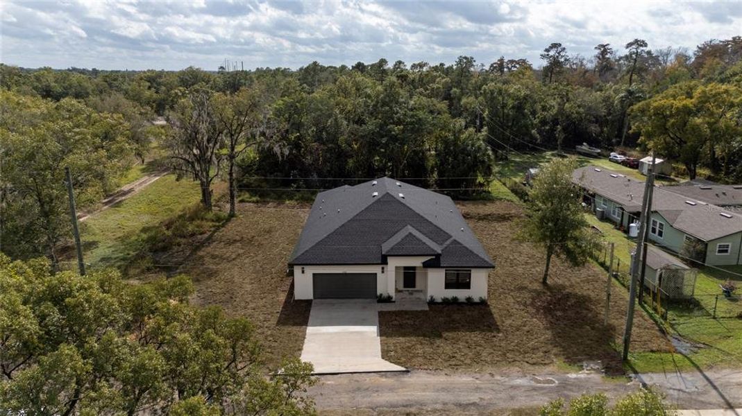 Front exterior of a new home in , Orlando, FL, highlighting curb appeal (Image 29). Front exterior of a new home in , Orlando, FL, highlighting curb appeal (Image 29).
