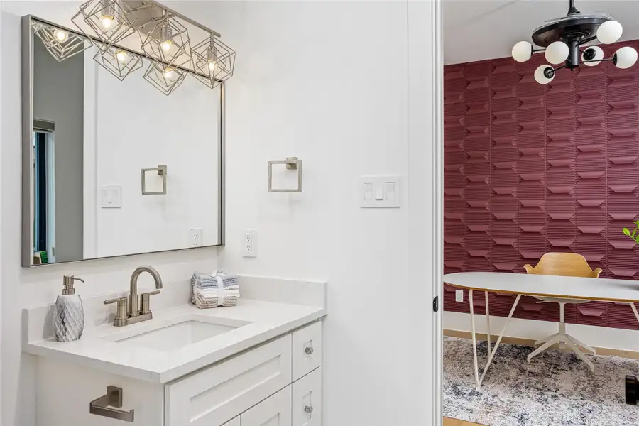 A Jack & Jill bath connects bedrooms three and four, adorned with sophisticated tile work and premium fixtures A Jack & Jill bath connects bedrooms three and four, adorned with sophisticated tile work and premium fixtures