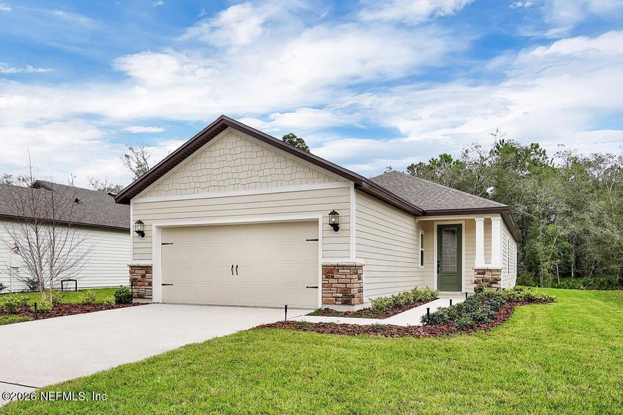 Front exterior of a new home in , Jacksonville, FL, highlighting curb appeal (Image 1). Front exterior of a new home in , Jacksonville, FL, highlighting curb appeal (Image 1).