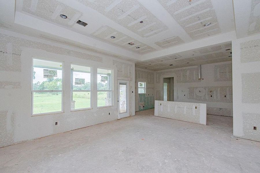 Spacious open-concept living area with large windows offering abundant natural light and scenic views, perfect for customization. Spacious open-concept living area with large windows offering abundant natural light and scenic views, perfect for customization.