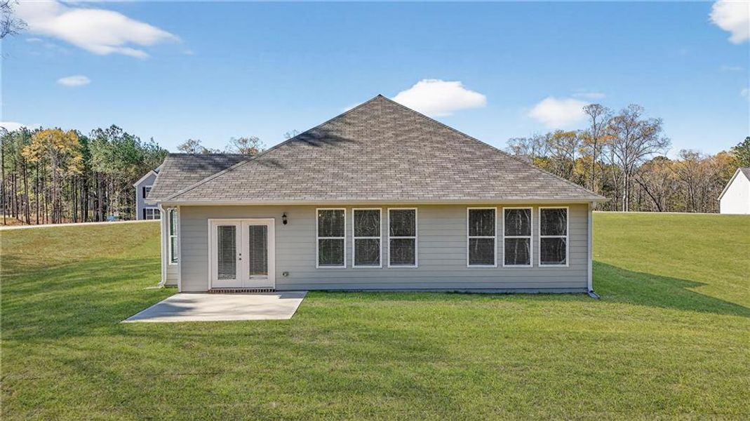 Exterior details and patio area of a home in Waters Edge, Mansfield (Image 17).