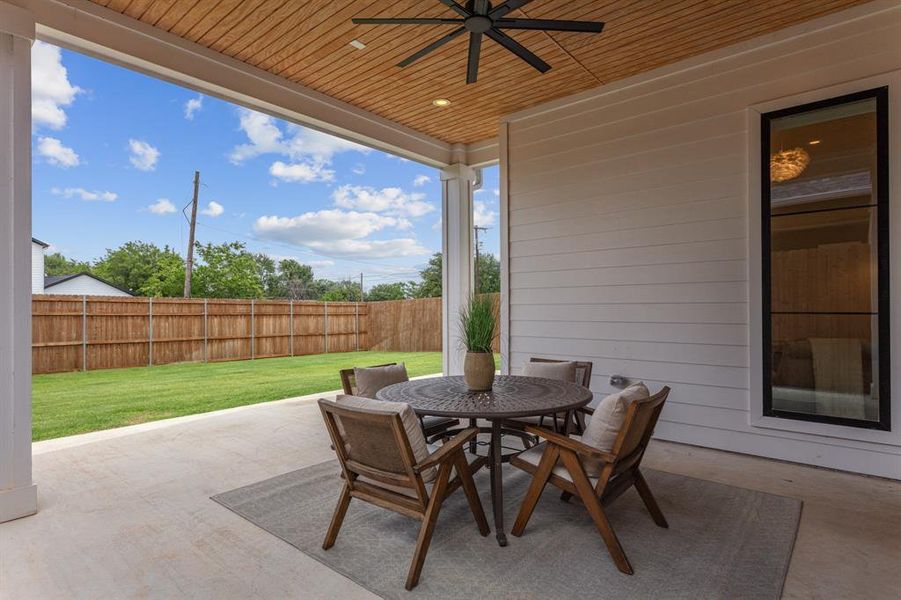 View of patio with a ceiling fan and outdoor dining space View of patio with a ceiling fan and outdoor dining space