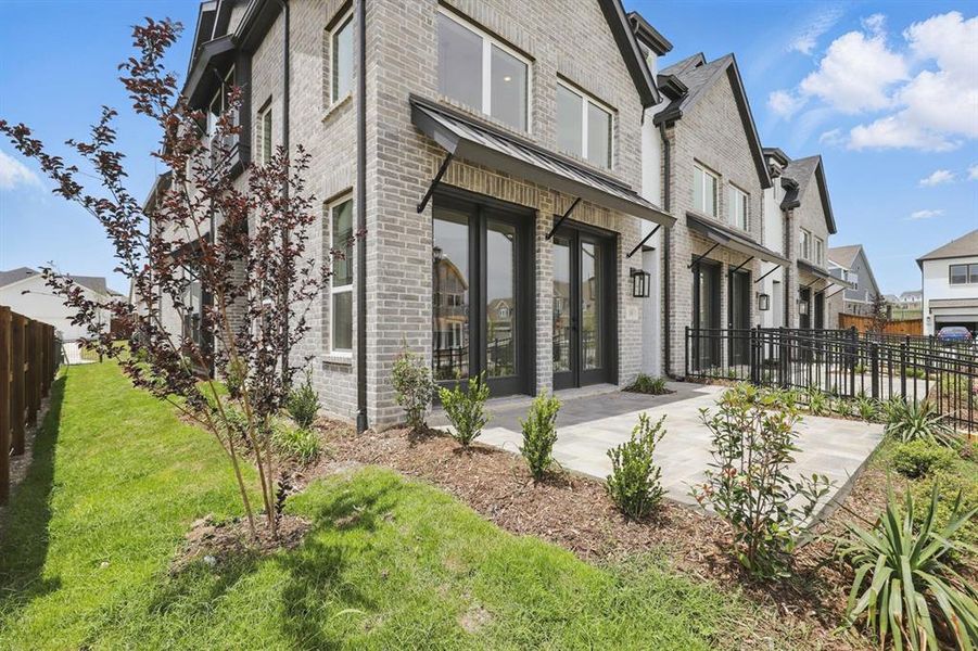 Front exterior of a new home in Walsh: Townhomes - The Patios, Aledo, TX, highlighting curb appeal (Image 19).