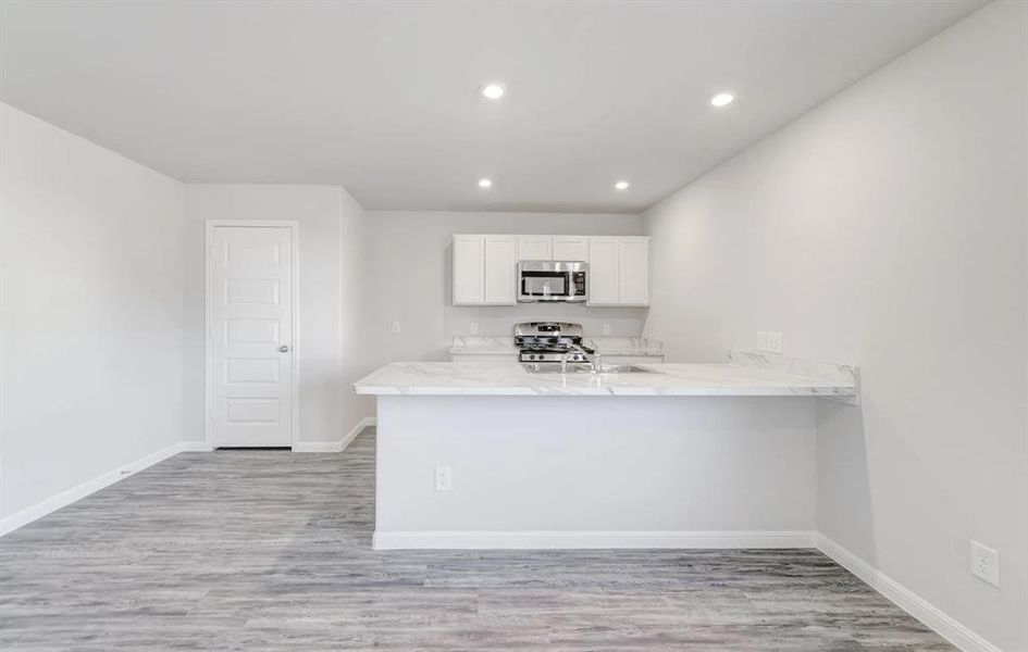 Furnished interior view inside a new home in Still Water Lake, Godley (Image 6).