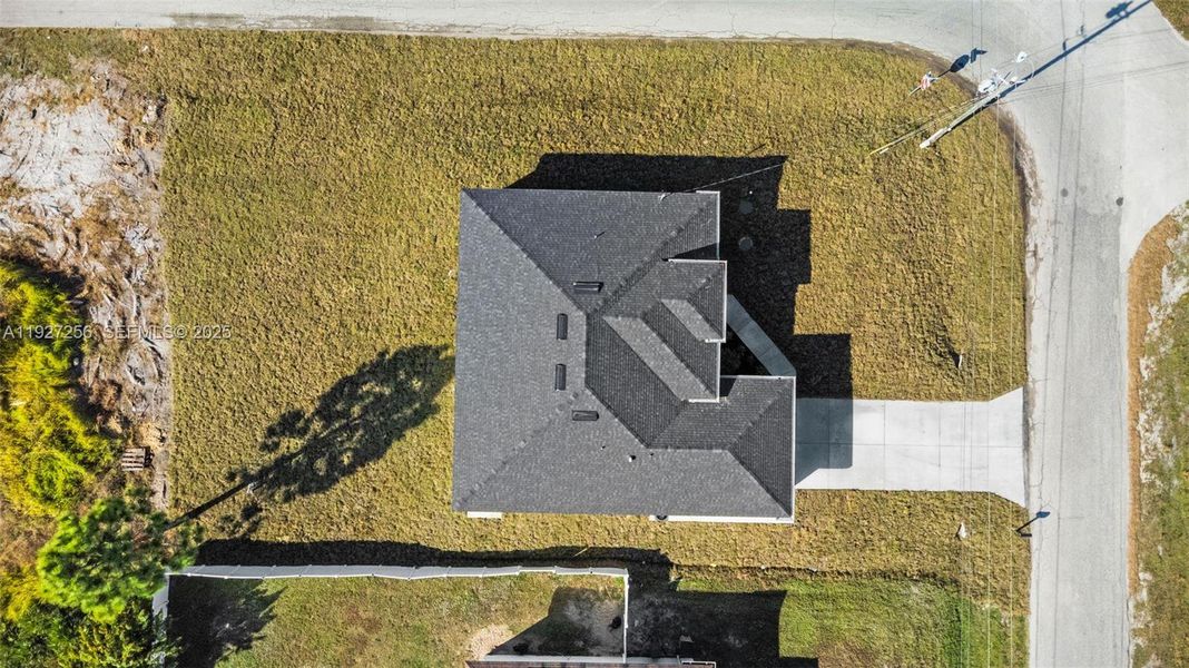 Front exterior of a new home in , Lehigh Acres, FL, highlighting curb appeal (Image 18).