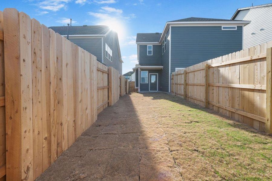 View of fenced backyard