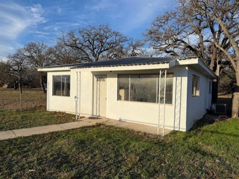 Exterior details and patio area of a home in , May (Image 10). Exterior details and patio area of a home in , May (Image 10).