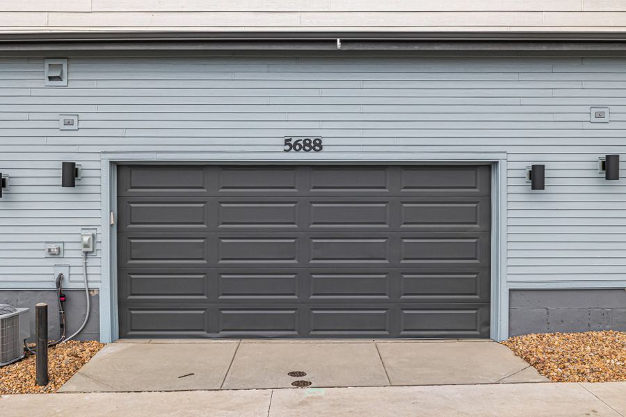 Front exterior of a new home in Painted Prairie, Aurora, CO, highlighting curb appeal (Image 27).