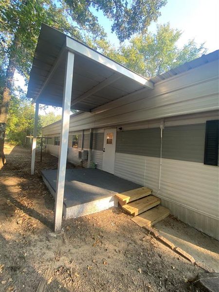 Front exterior of a new home in , Malakoff, TX, highlighting curb appeal (Image 15).
