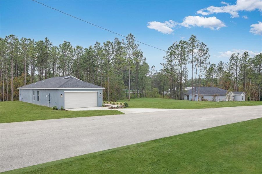 Front exterior of a new home in Marion Oaks, Ocala, FL, highlighting curb appeal (Image 5).
