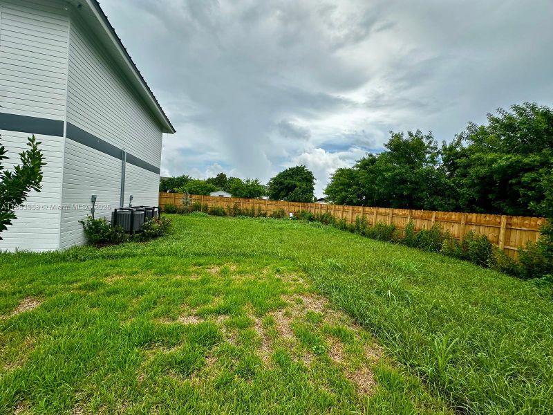 Front exterior of a new home in , Florida City, FL, highlighting curb appeal (Image 22). Front exterior of a new home in , Florida City, FL, highlighting curb appeal (Image 22).