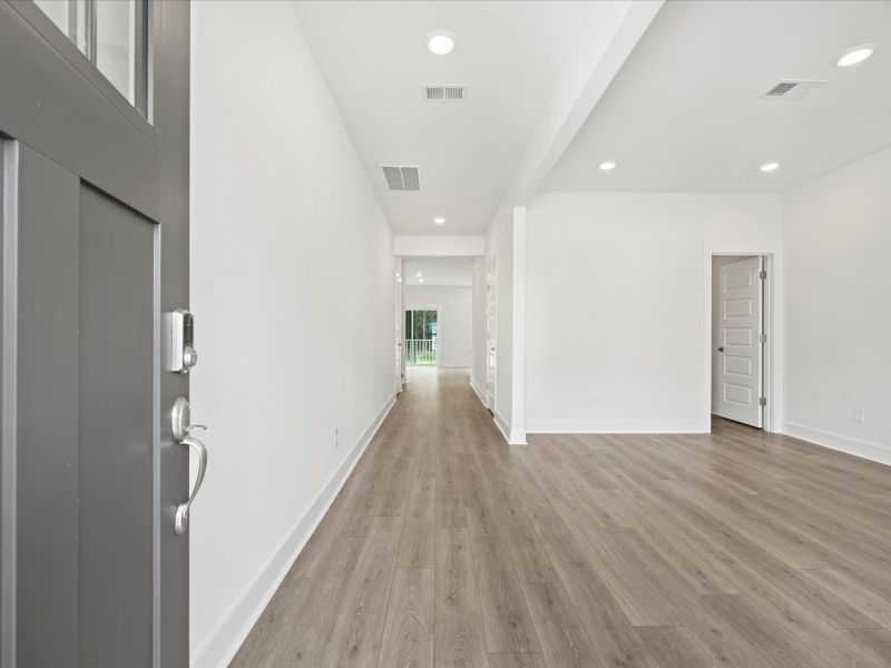 Spacious, unfurnished interior of a new home in The Coves at Lakes of Cane Bay, Summerville (Image 16).
