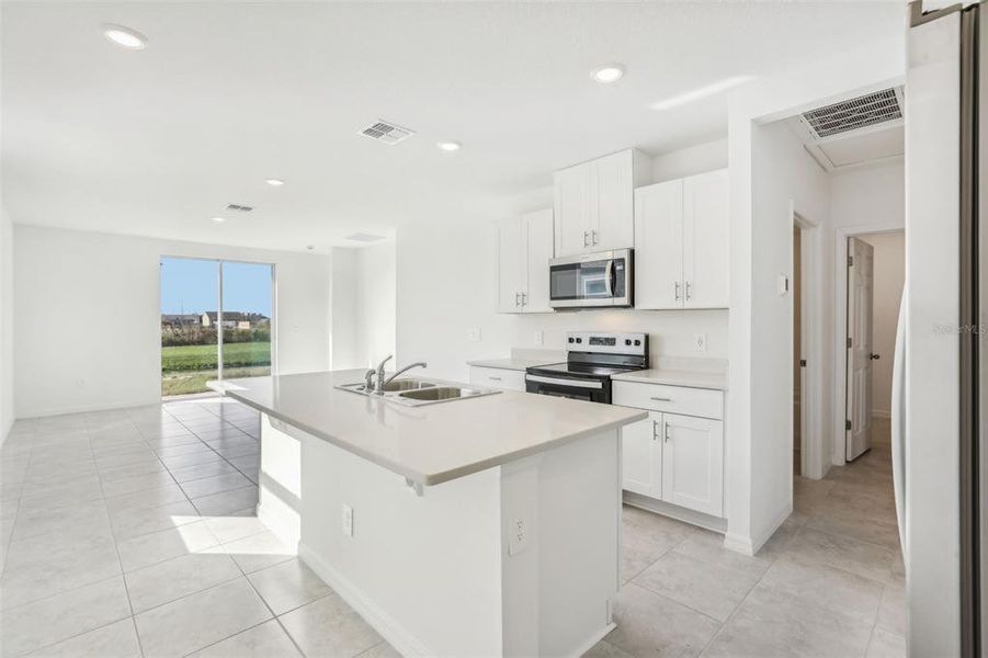 Furnished interior view inside a new home in Lake Deer Estates - Classic Series, Poinciana (Image 5).