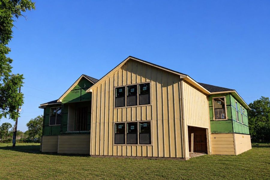 Front of home showing extended garage entry and oversized windows allowing much light. Front of home showing extended garage entry and oversized windows allowing much light.
