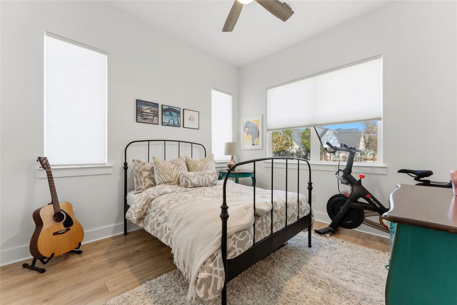 Bedroom featuring light wood finished floors and ceiling fan
