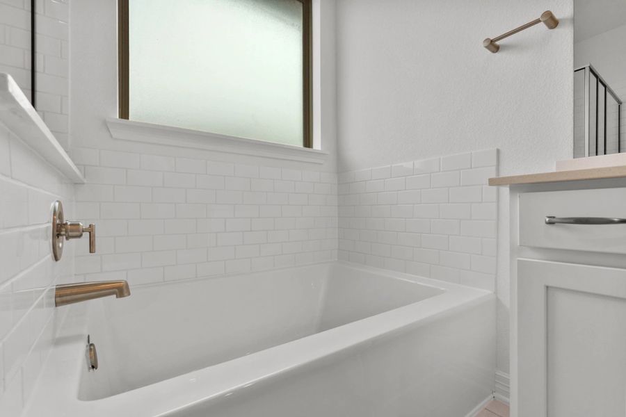 Primary bathroom.  Sample product photo. Actual exterior and interior selections may vary by homesite. Photo may be virtually staged.