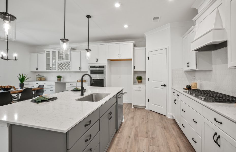 Bright Open Kitchen with Large Island and Café