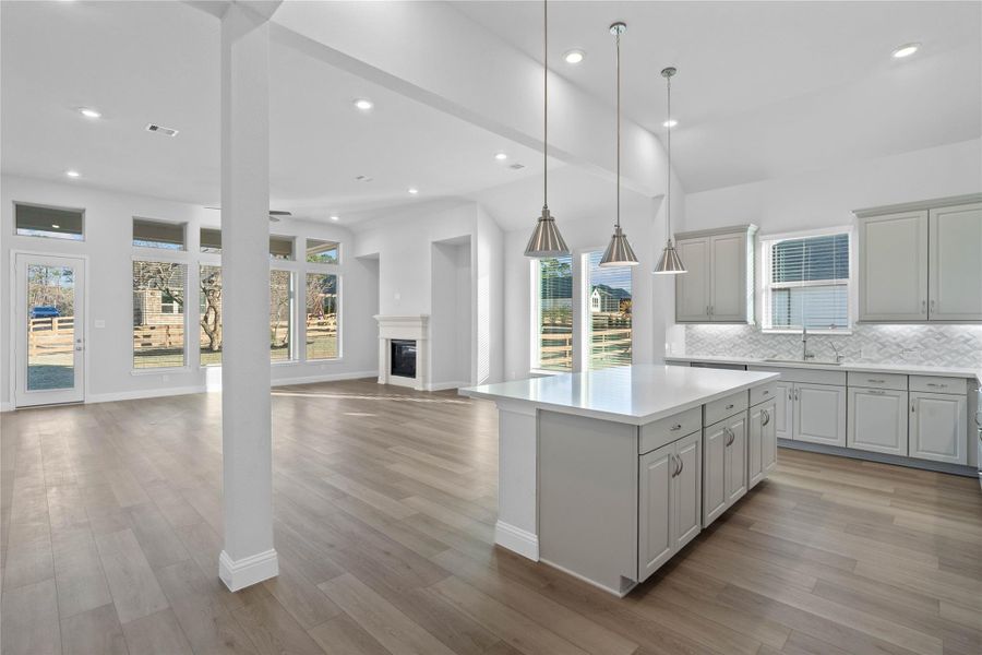 Bright, open-concept living designed for both everyday comfort and effortless entertaining. This expansive space features soaring ceilings, abundant natural light, and seamless flow between the kitchen and living area. Bright, open-concept living designed for both everyday comfort and effortless entertaining. This expansive space features soaring ceilings, abundant natural light, and seamless flow between the kitchen and living area.